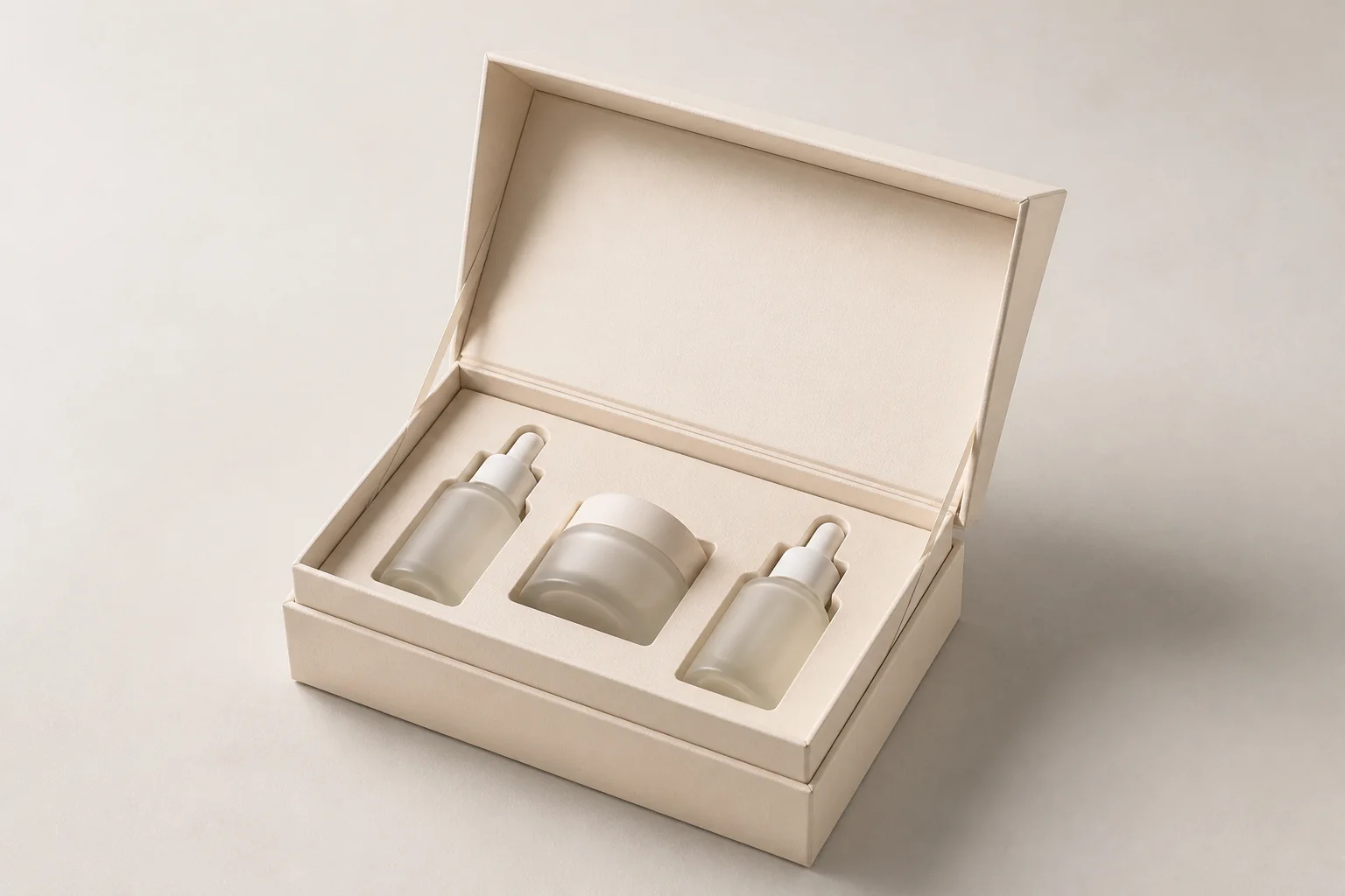 Open cream skincare box holding three containers