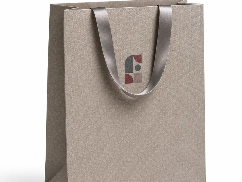 Textured taupe paper shopping bag with satin handles